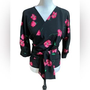 Zara women’s short sleeve wrap front blouse. Pink roses on black background.